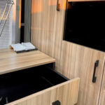 Executive office table with L-shape design and ample storage.